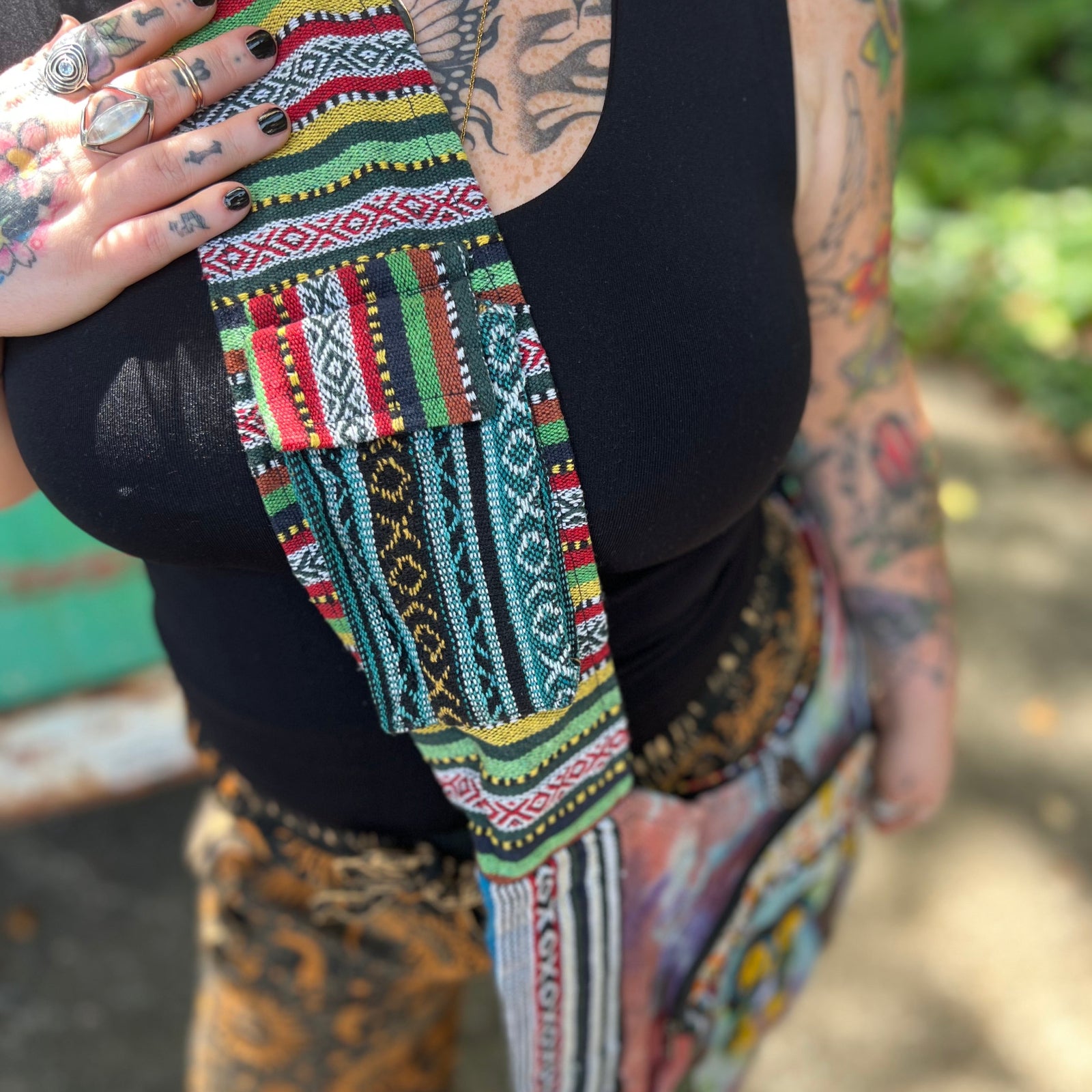 Someone wearing the Tie Dye Owl with Mushroom Cotton & Hemp Pocket Bag in front of a vintage Volkswagen bus.