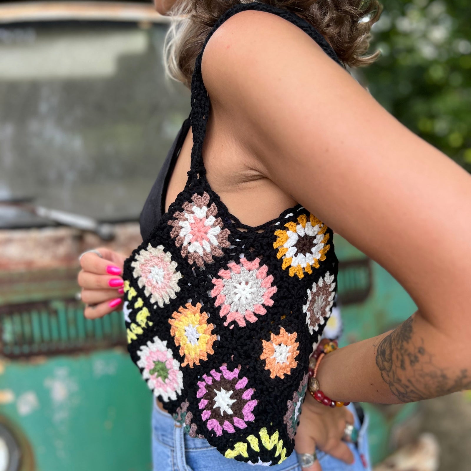 Someone wearing the black Bohemian Handmade Crochet Bag.