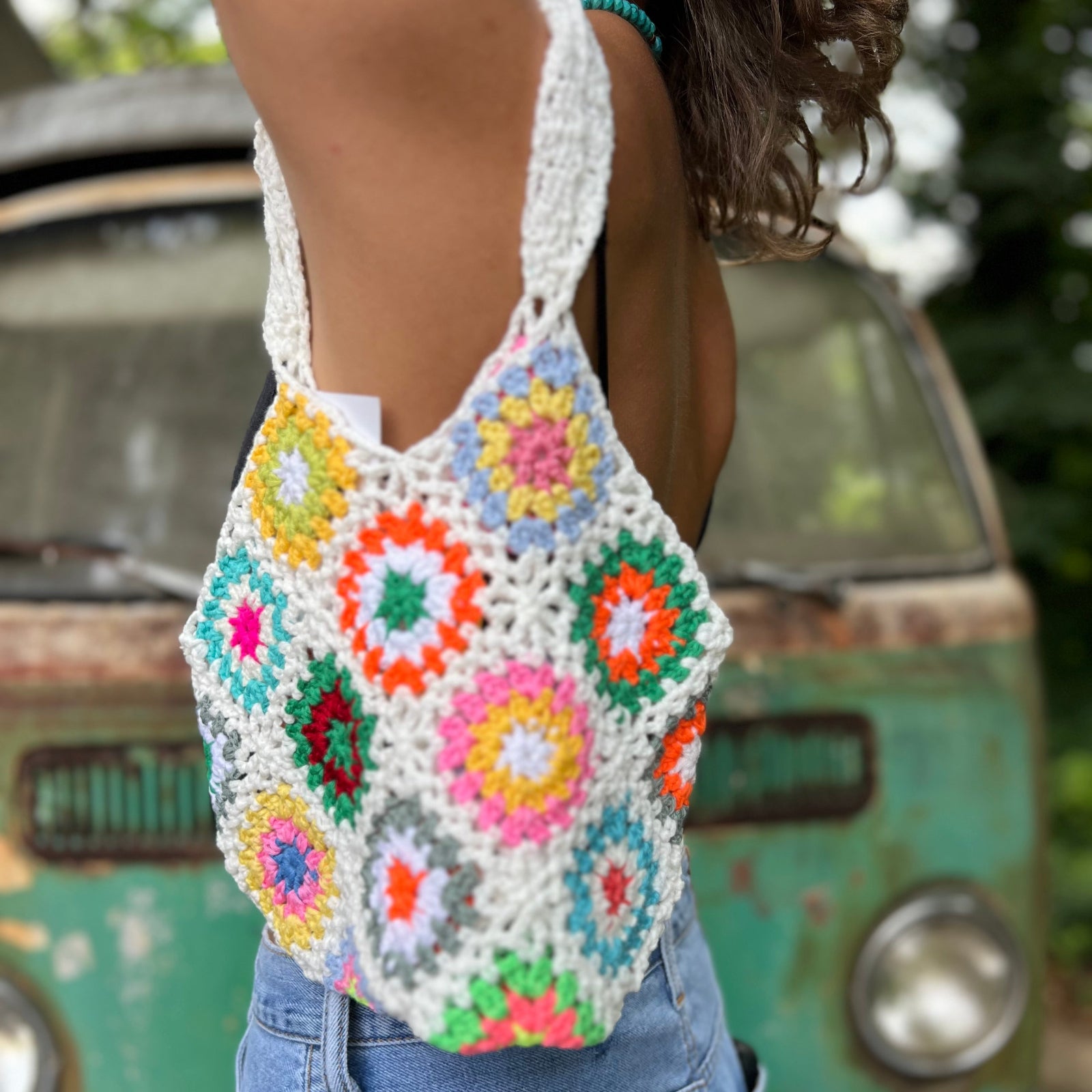 Someone wearing the white Bohemian Handmade Crochet Bag.