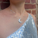 Someone wearing the The Hare Moon Silver Necklace.