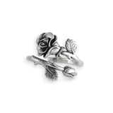 Silver rose and branch design ring on a white background