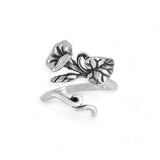 Silver floral design ring on a white background