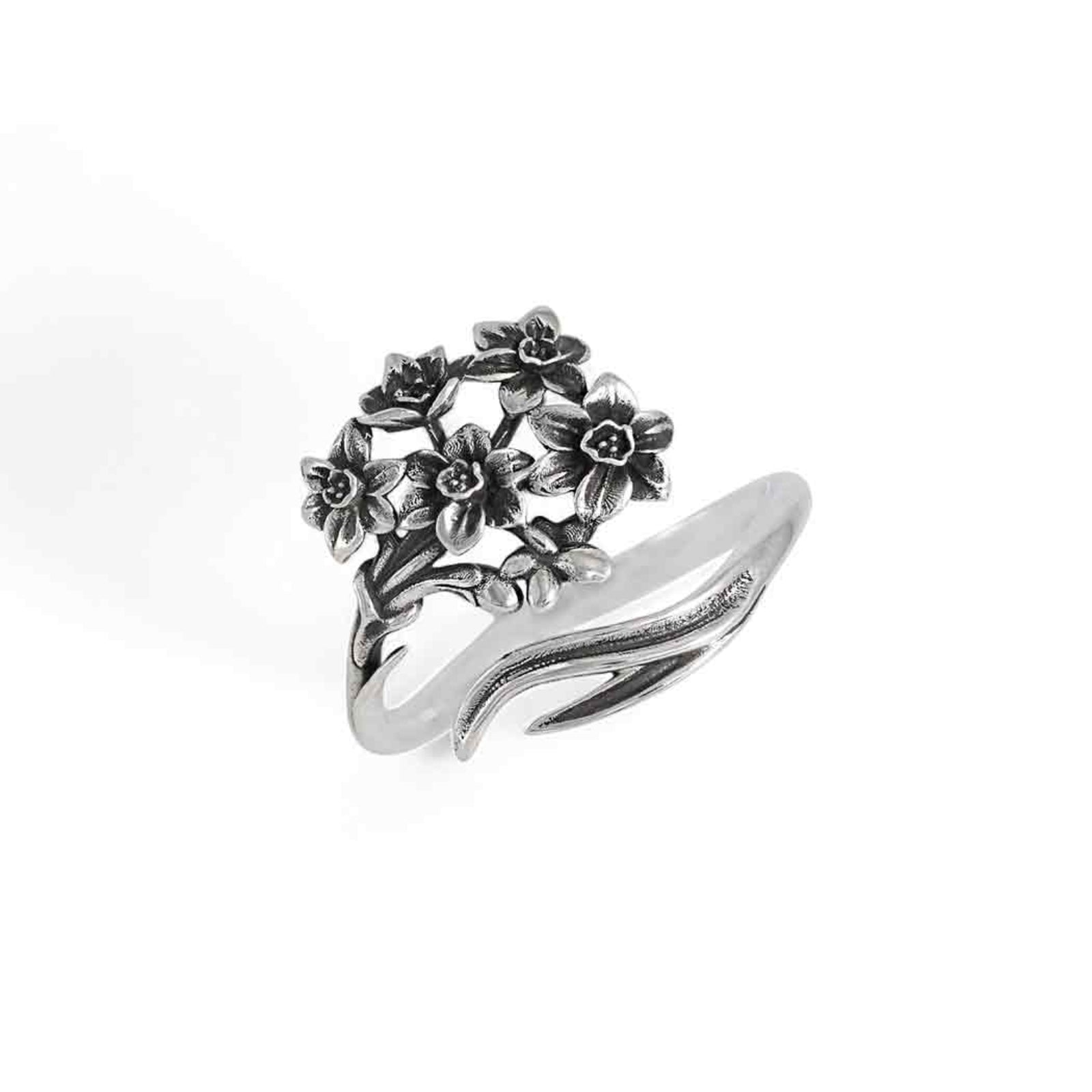 Silver ring with floral design on a white background