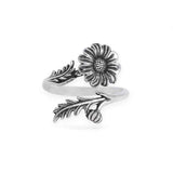 Silver ring with floral design on a white background