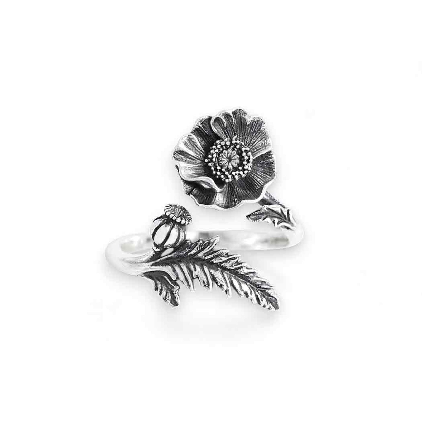 Silver ring with floral design on a white background