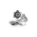 Silver ring with floral design on a white background