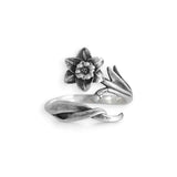 Silver ring with floral design on a white background