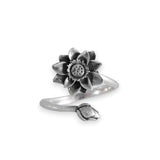 Silver flower-shaped ring on a white background