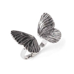 Silver butterfly wing ring on a white background