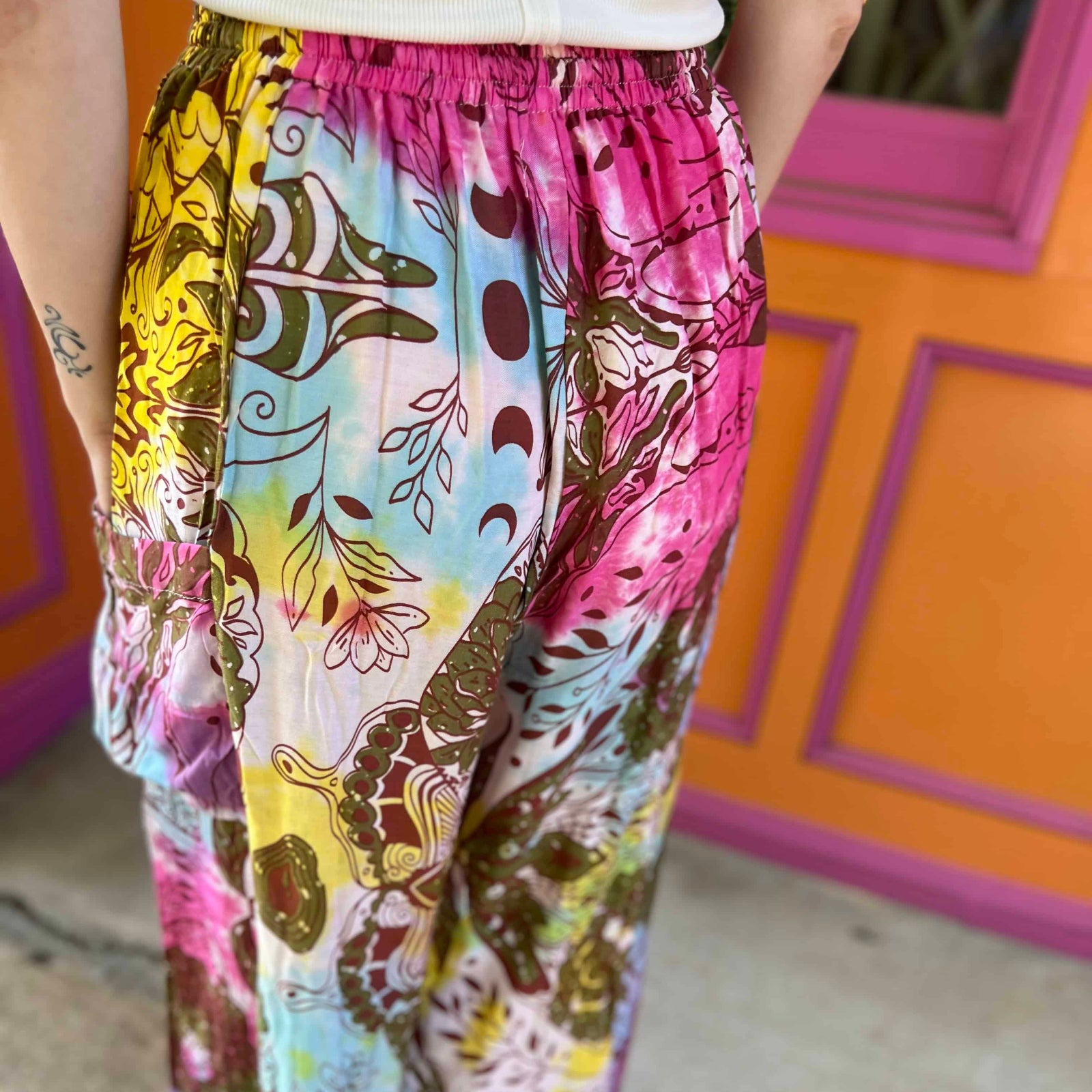 Back view of boho tie-dye moth print pants with pockets close up view
