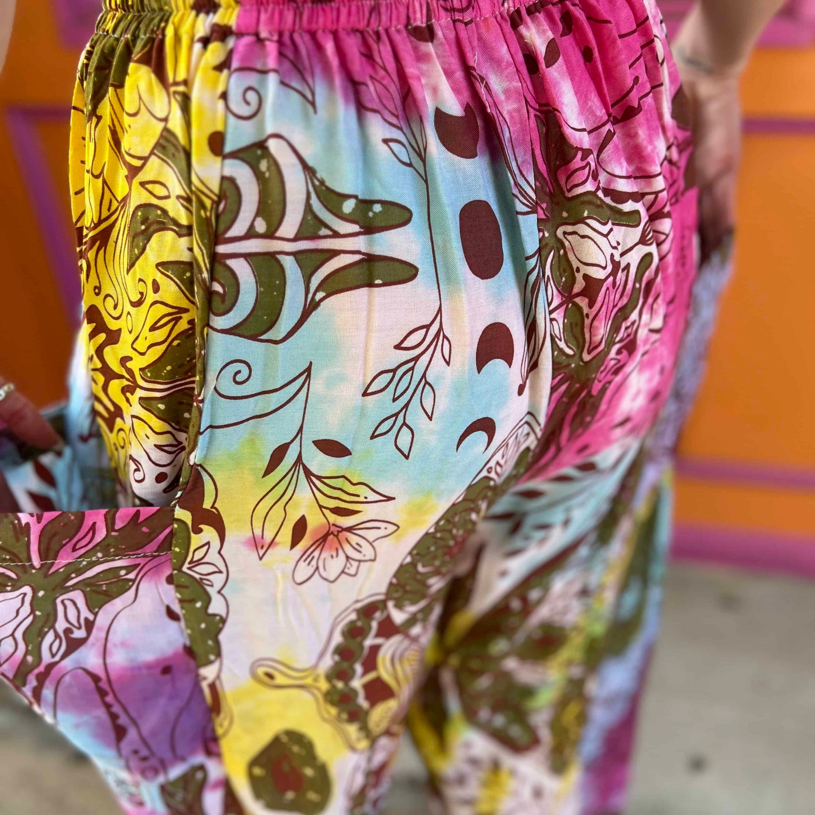 Back view of boho tie-dye moth print pants with pockets