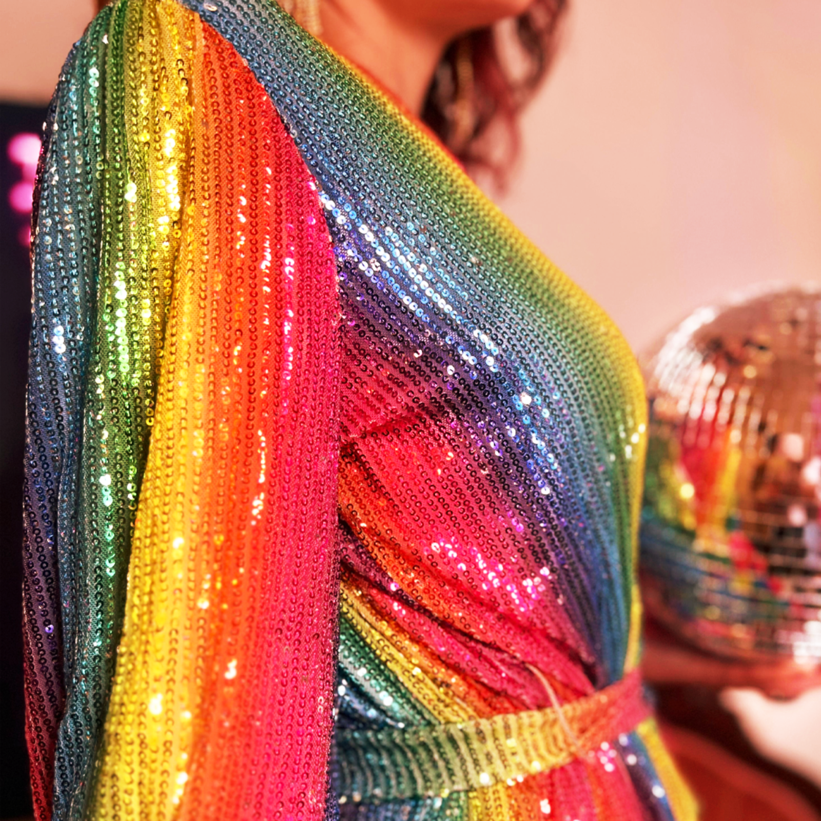 An up-close image of the side of the Disco Rainbow Wrap Dress.