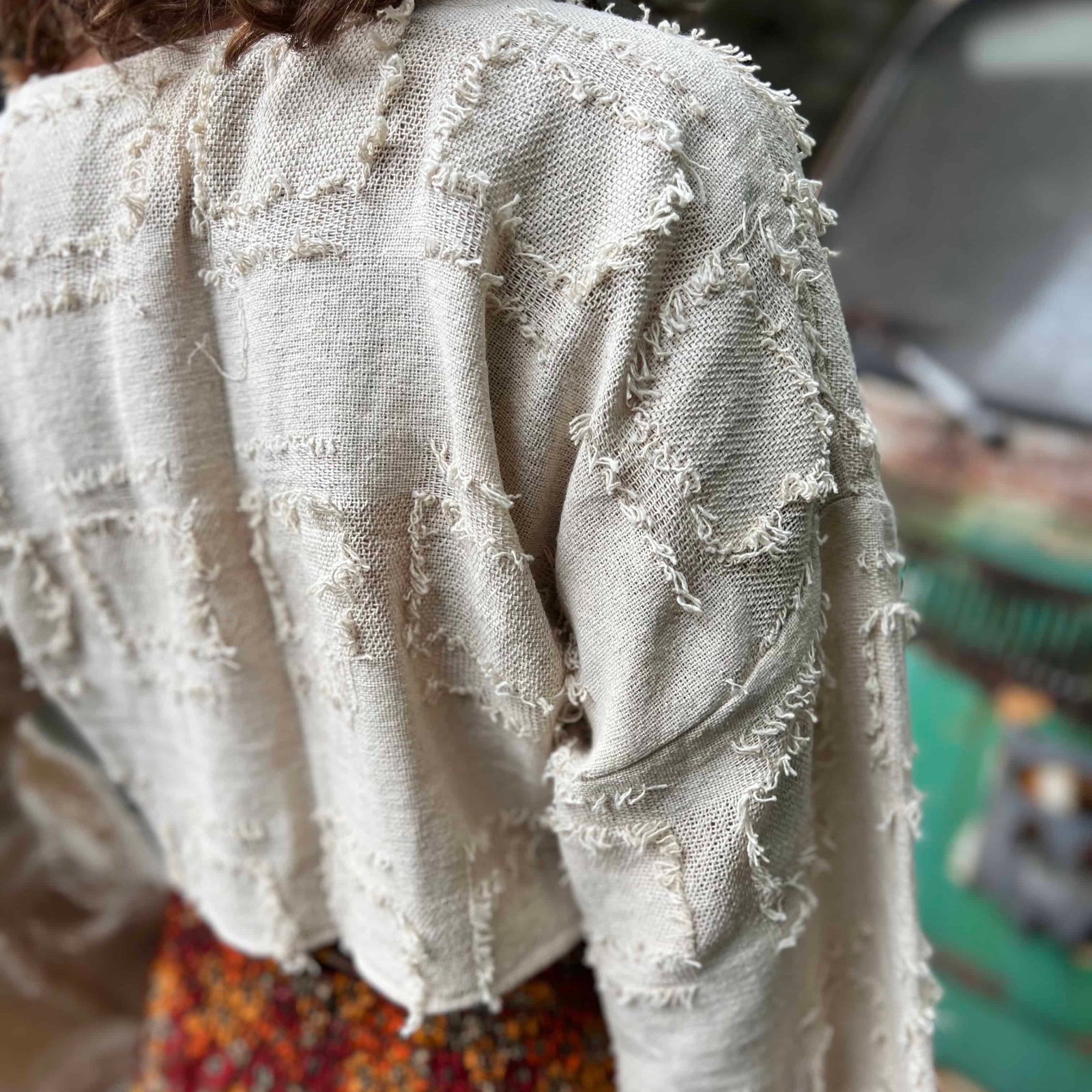 Side view of grunge boho bell sleeve cotton crop top