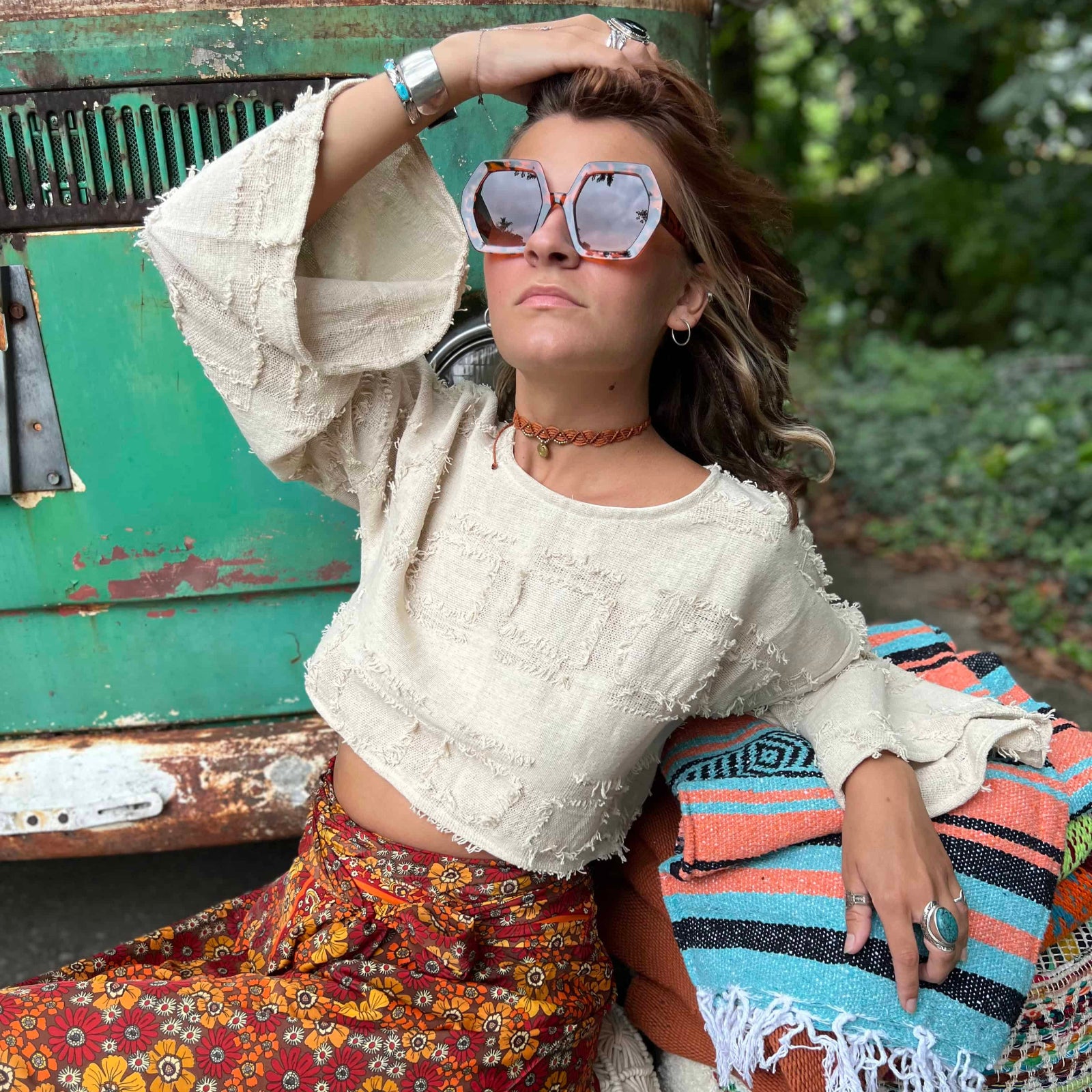 Close-up of wide bell sleeve detail on boho crop top