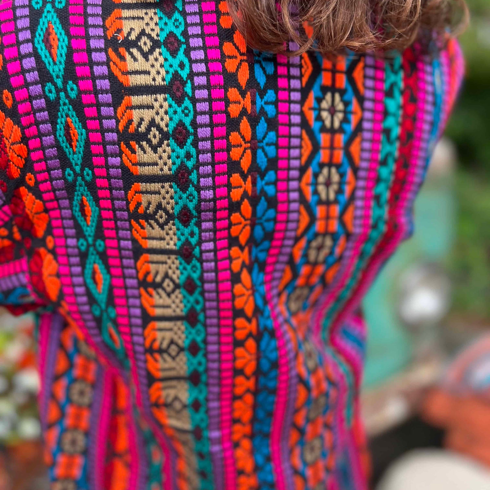 Close-up of cotton weave on bohemian trench jacket