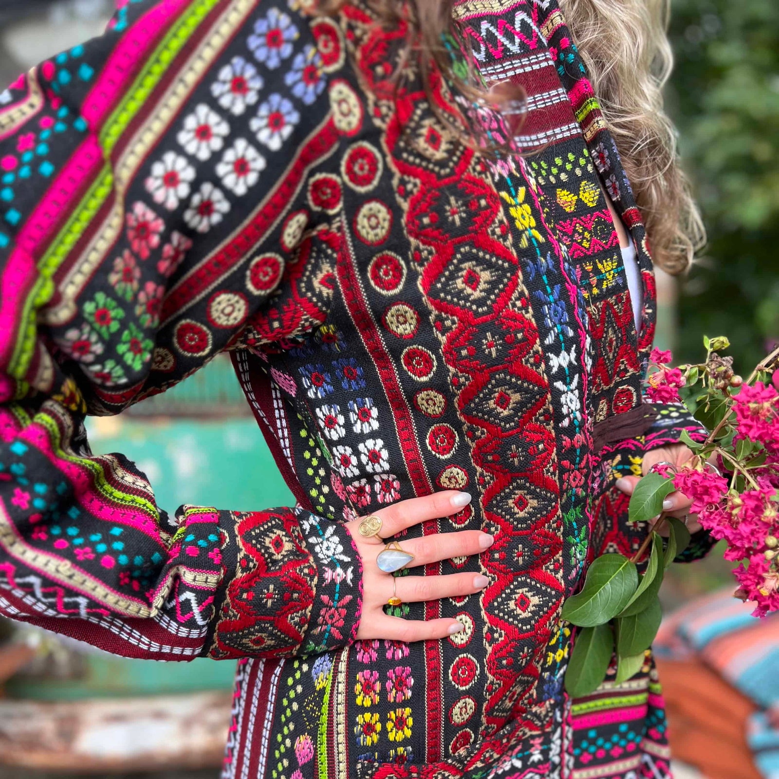 Button closure detail of cotton boho festival unisex trench coat
