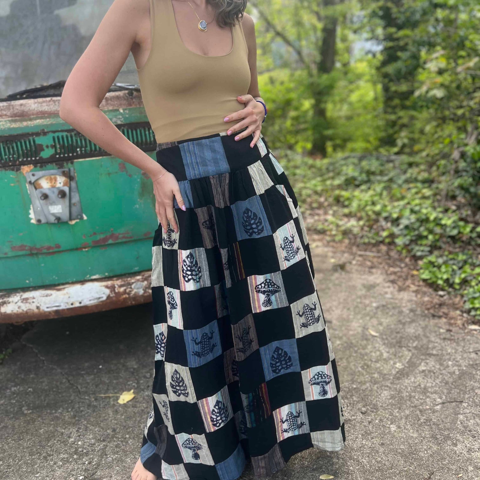 Flowy festival-ready skirt with leaf, frog, and mushroom block prints