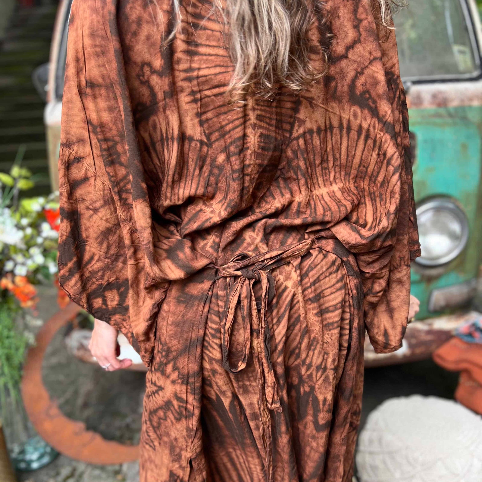 Full back shot of brown bohemian hand-dyed kimono with lotus