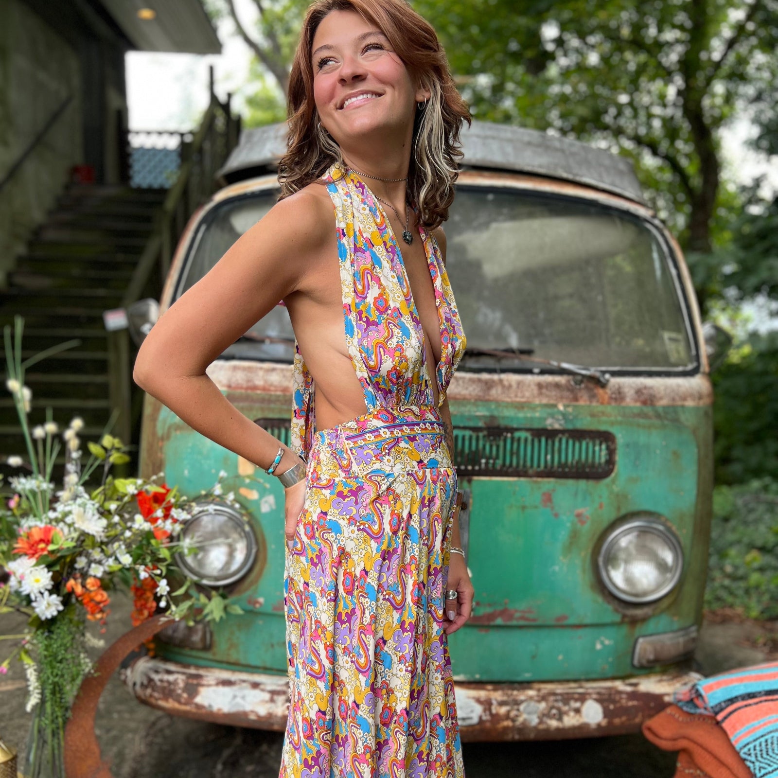 Side profile of psychedelic rainbow boho silk jumpsuit