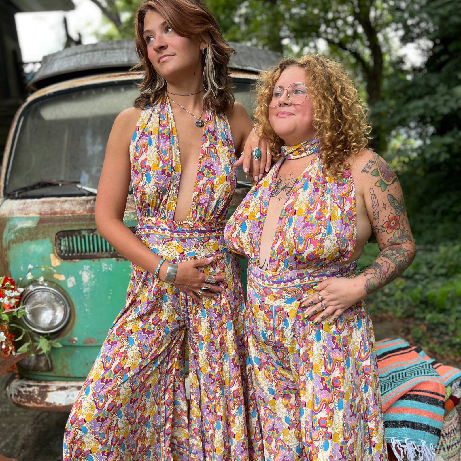 Group photo of size inclusive models in rainbow jumpsuits