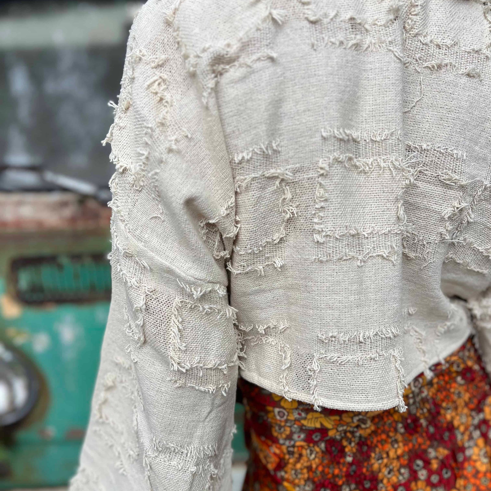 Back view of bohemian grunge bell sleeve crop top