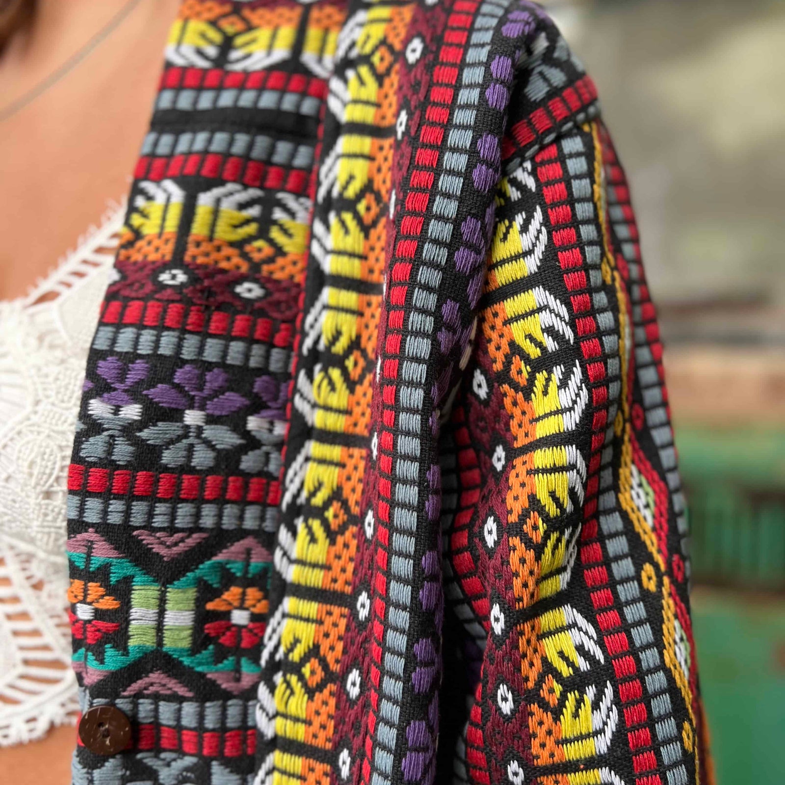 Festival unisex bohemian trench coat displayed on clothing rack