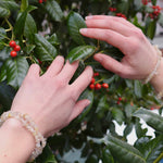 Golden Rutile Crystal Bracelet over holly bush