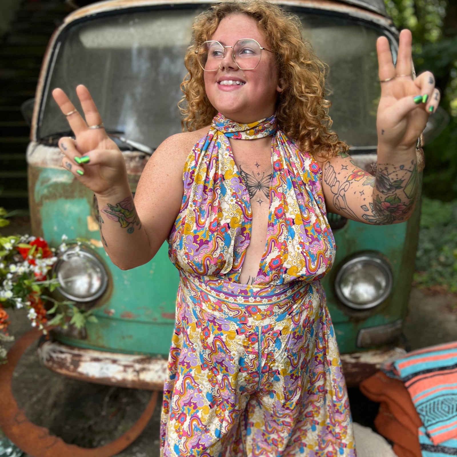 Plus size festival fashion in flowy rainbow jumpsuit