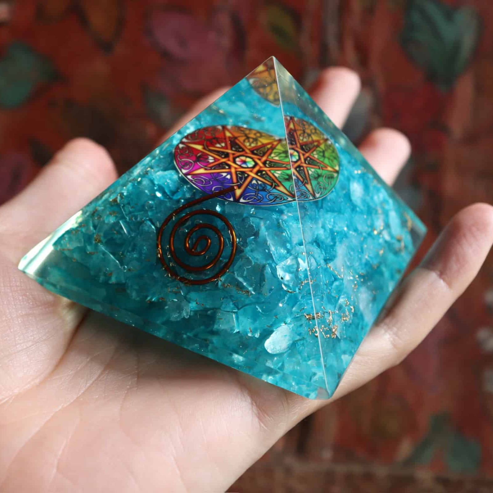 Blue dyed agate orgone pyramid with copper spiral front view
