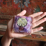 Top view of purple orgone pyramid with sacred tree design