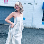 flowing cotton gauze midi dress captured in winston salem city backbround