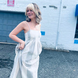 flowing cotton gauze midi dress captured in winston salem city backbround