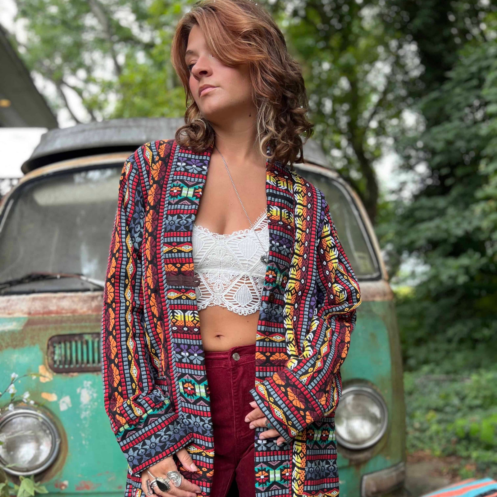 Boho handmade longline unisex trench coat photographed on stairs