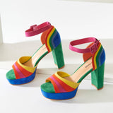 A pair of colorful suede peep toe pumps with adjustable ankle straps and a 4.5 inch heel.