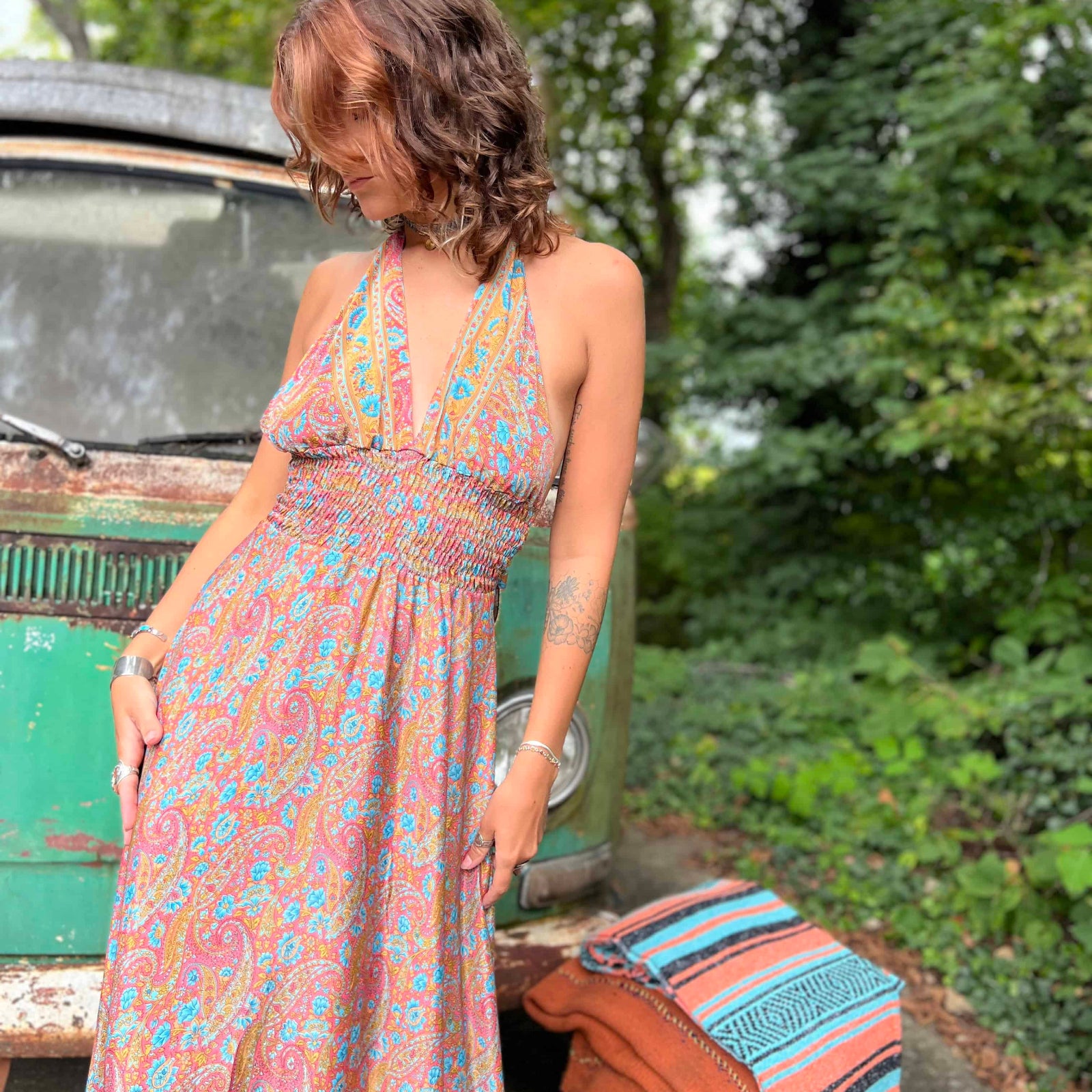 Full body shot of hippie silk boho maxi dress outdoors