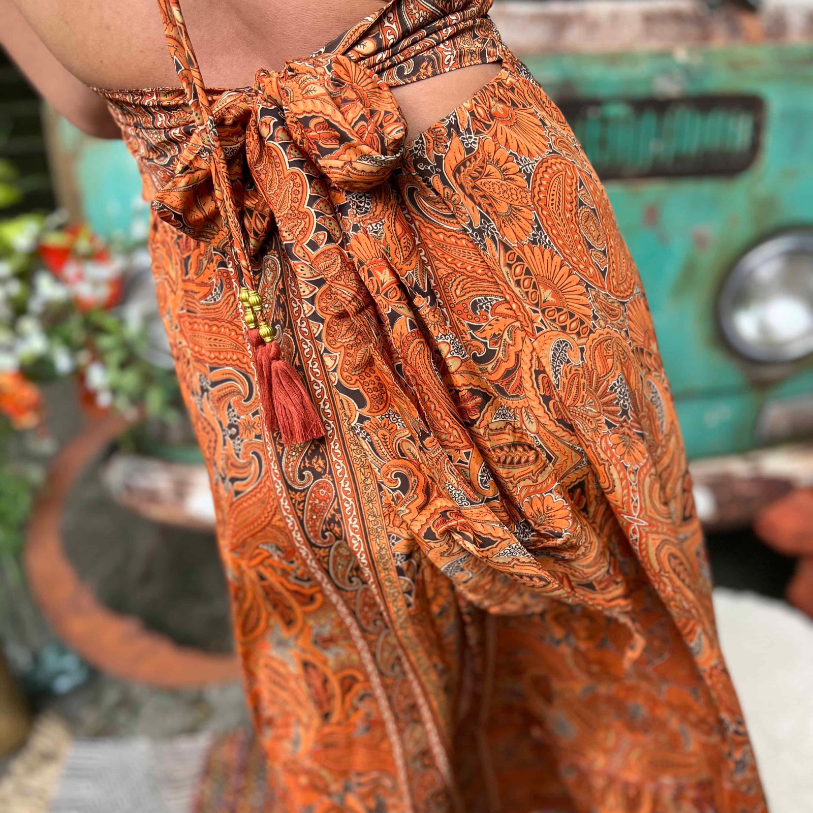 Close-up of bow tie detail on boho maxi silk dress