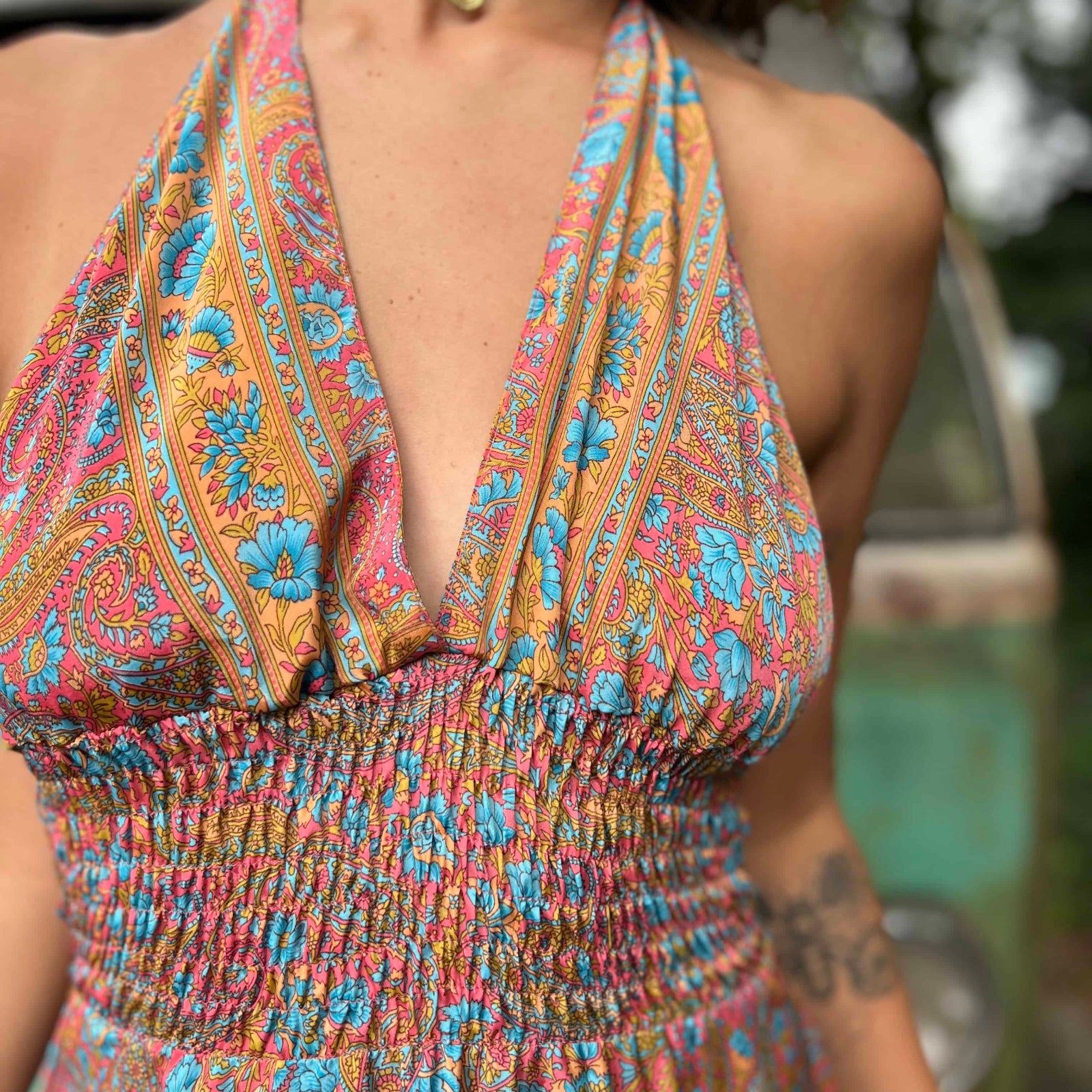 Front detail of tassel ties on silk boho maxi dress