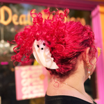 Someone with pink hair wearing the large Ghost Claw hair clip.