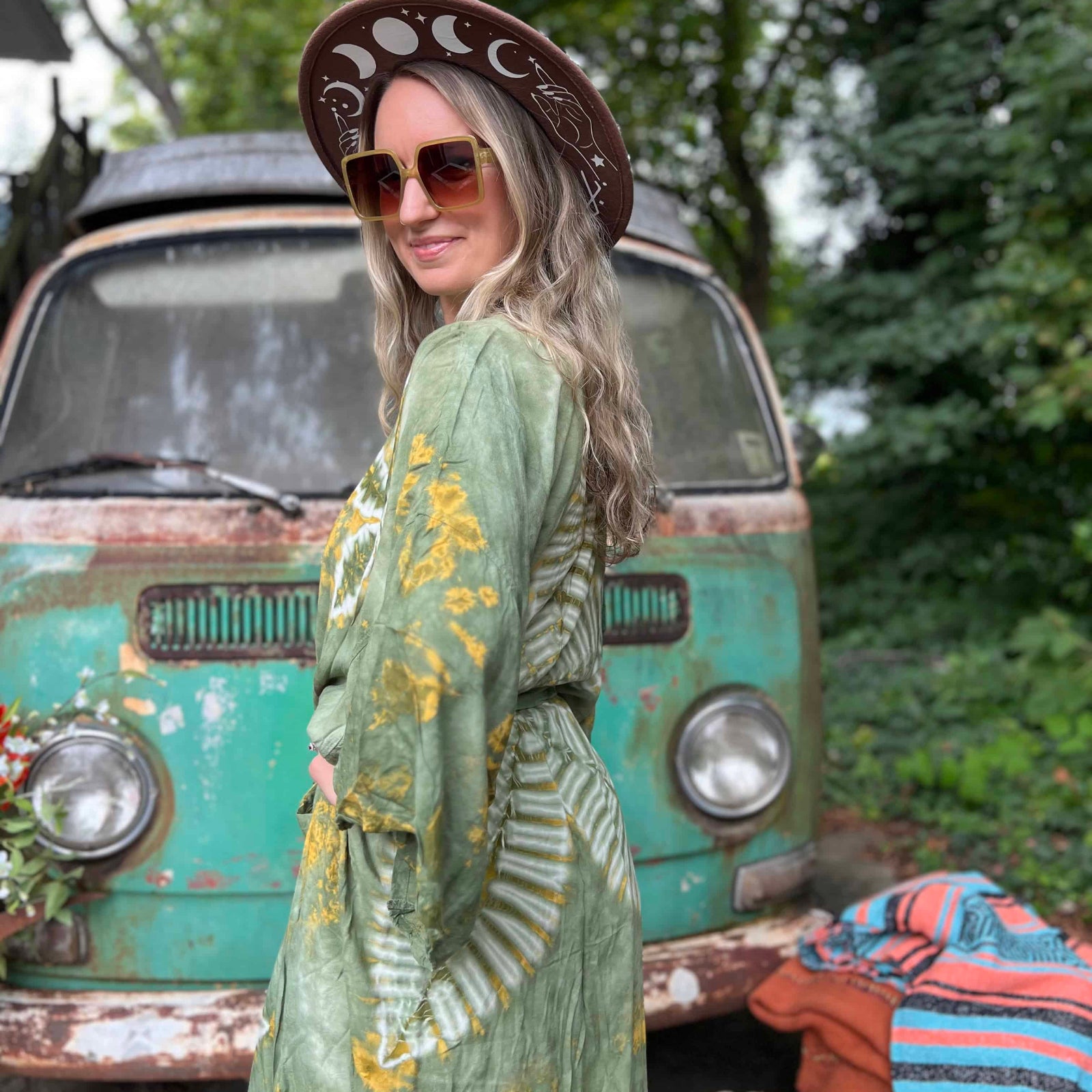 Side view of earthy green boho hand-dyed kimono with wide sleeves