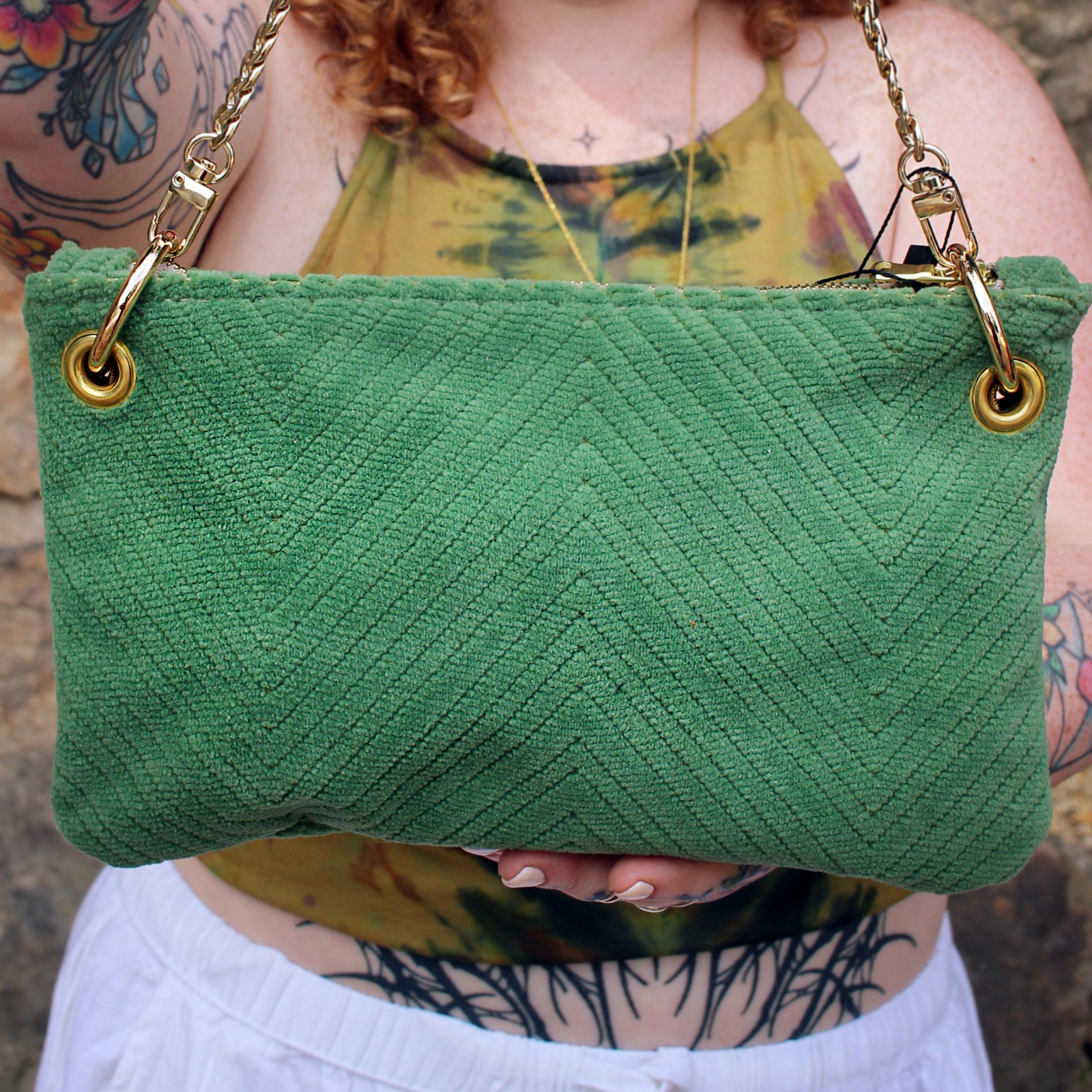 Someone holding the Chevron Vintage Green Velvet Crossbody Bag.