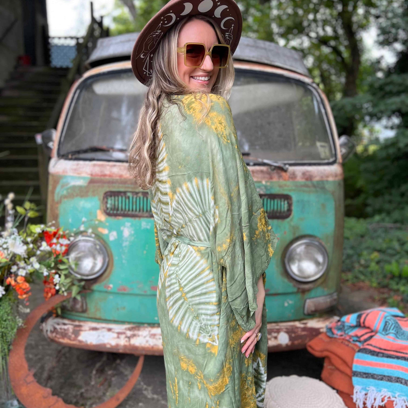 Close-up of lotus flower tie dye on green bohemian kimono back
