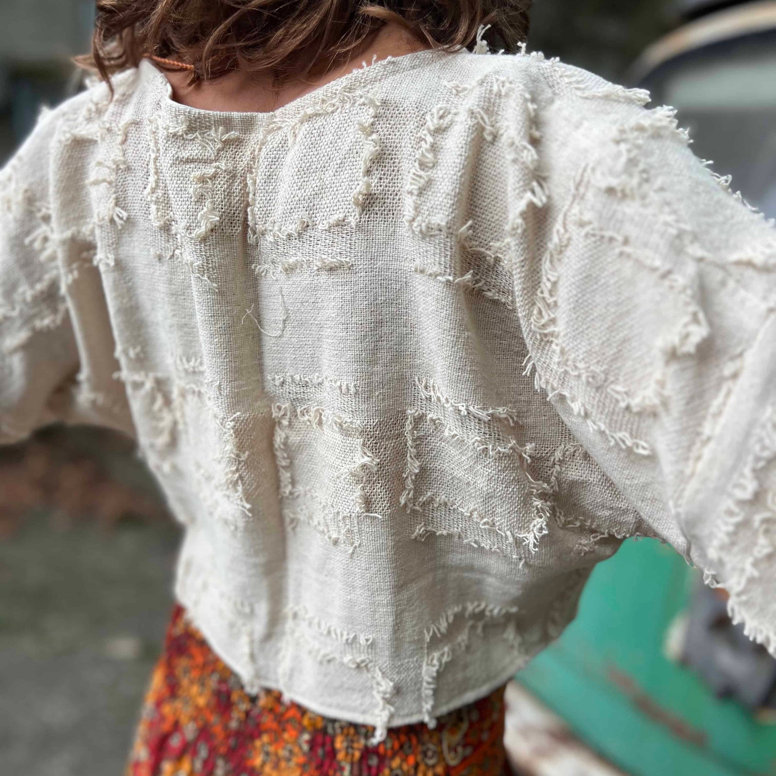 Close-up of cotton bohemian bell sleeve crop top fabric