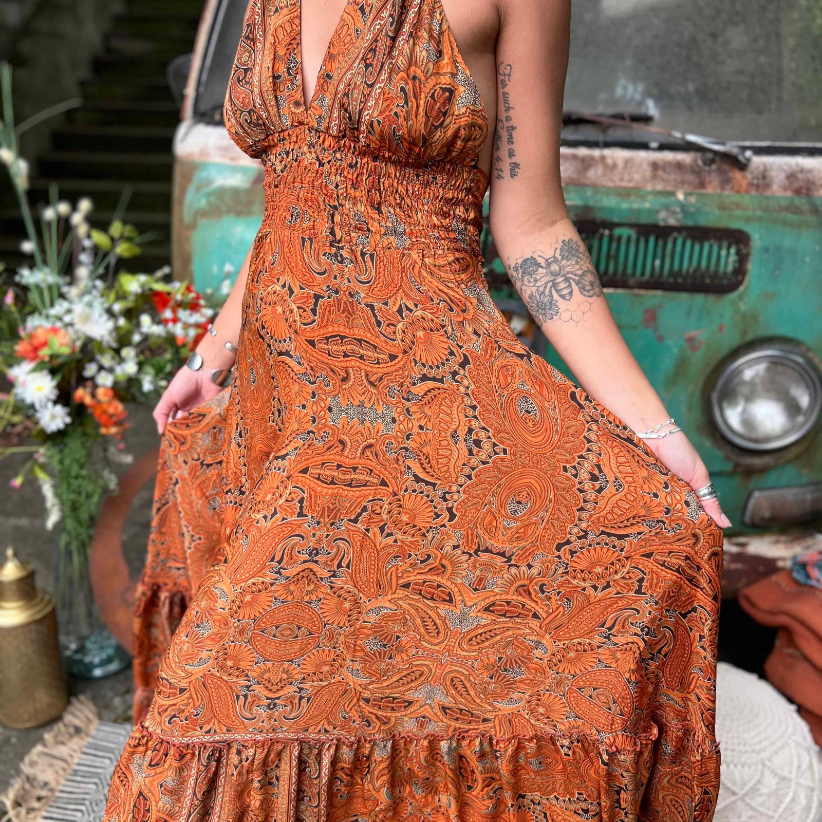 Elegant silk maxi dress styled as bohemian wedding guest outfit