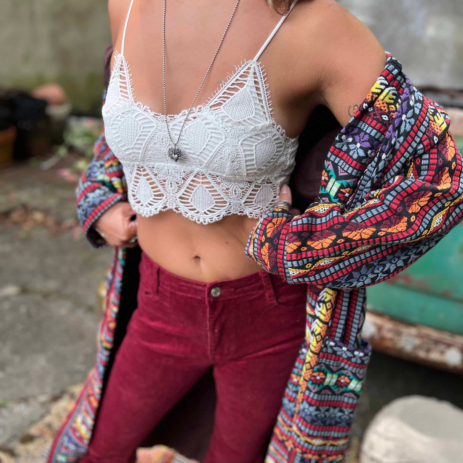 Full-length pose of hippie boho unisex jacket trench style