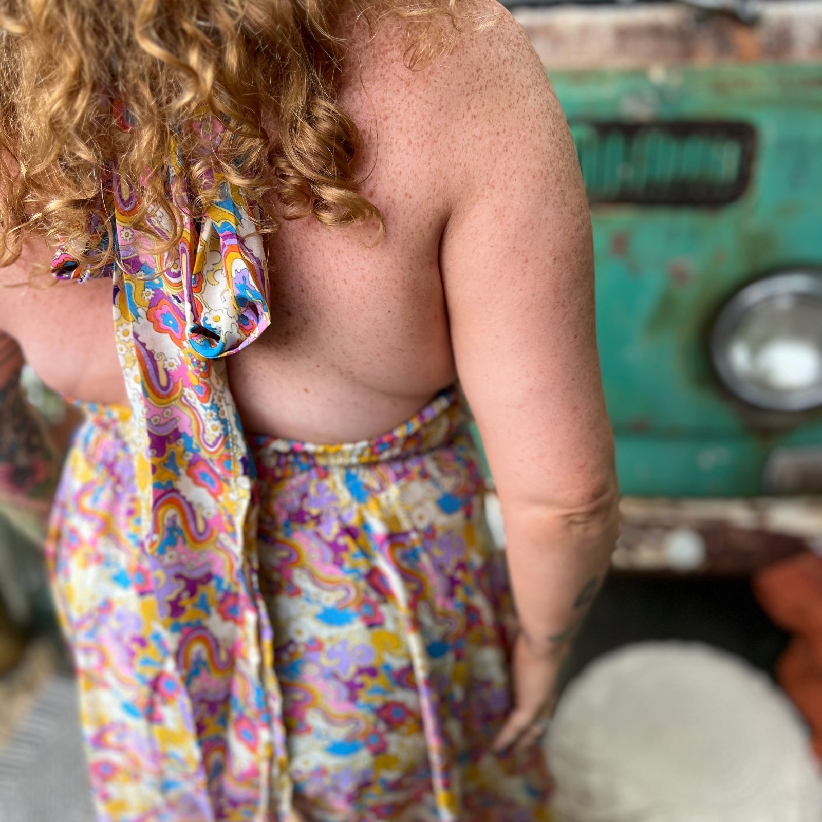 Free-spirited rainbow jumpsuit with multi-way ties