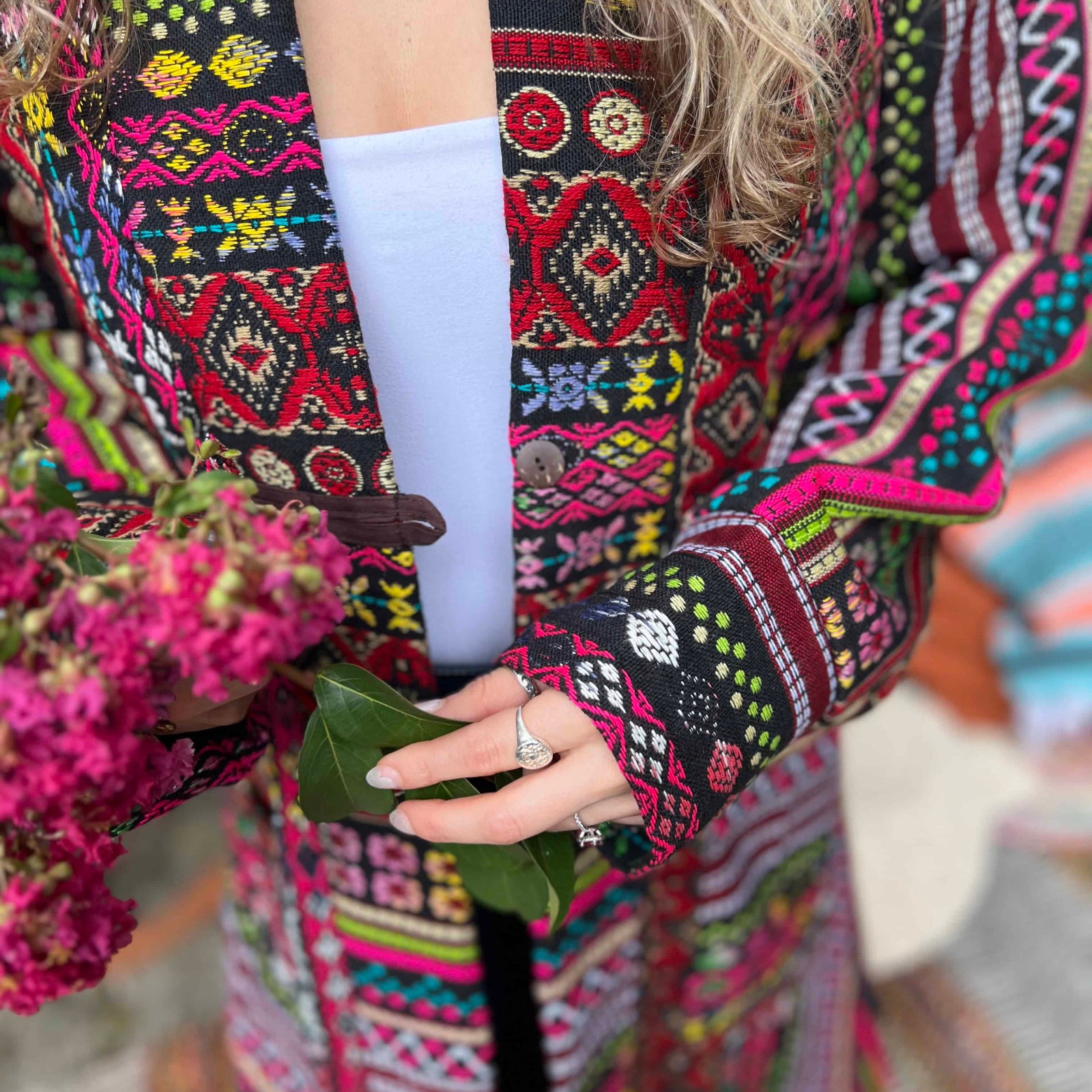 Detailed shot of festival boho trench coat woven cotton pattern