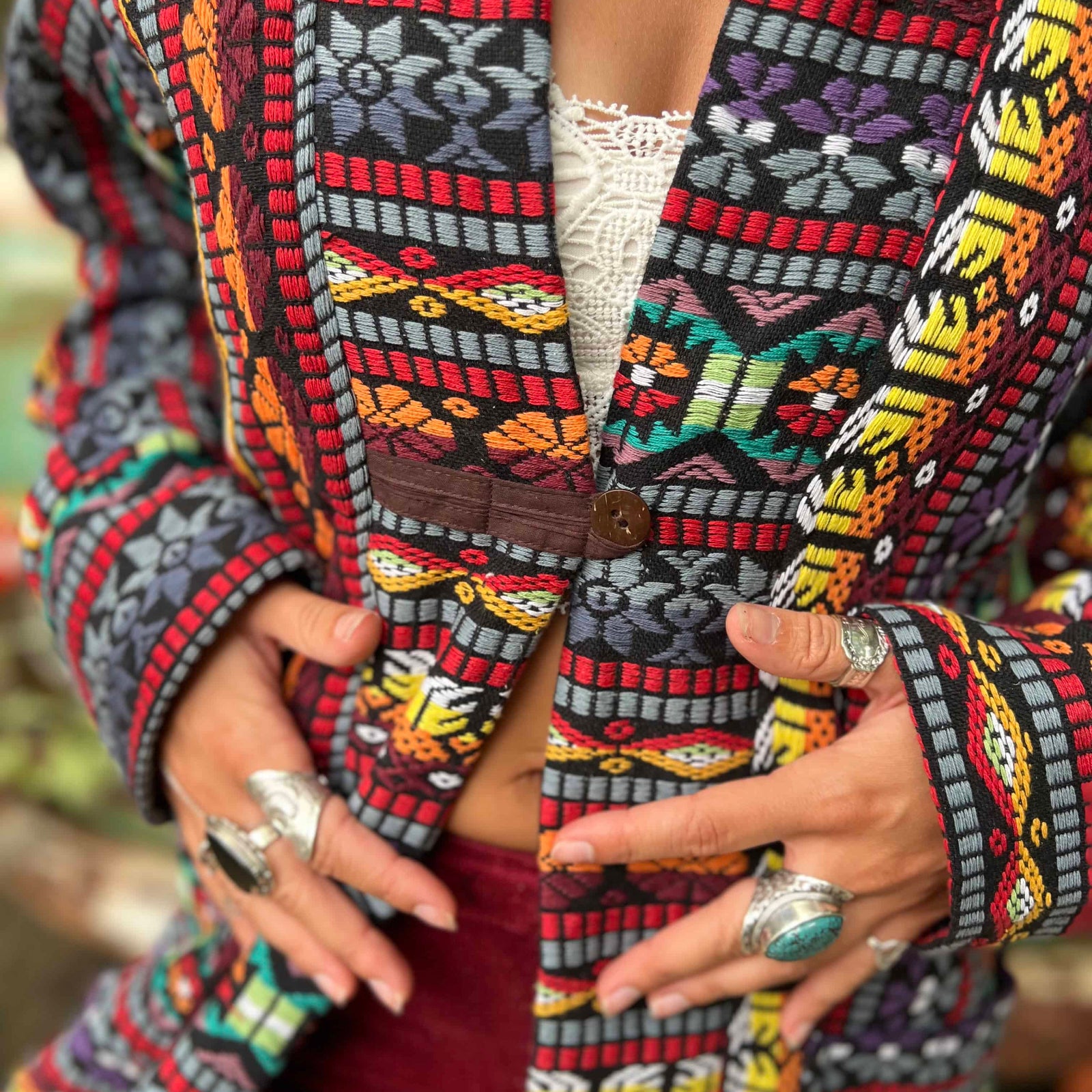 Woven handmade unisex long boho trench coat outdoors in nature