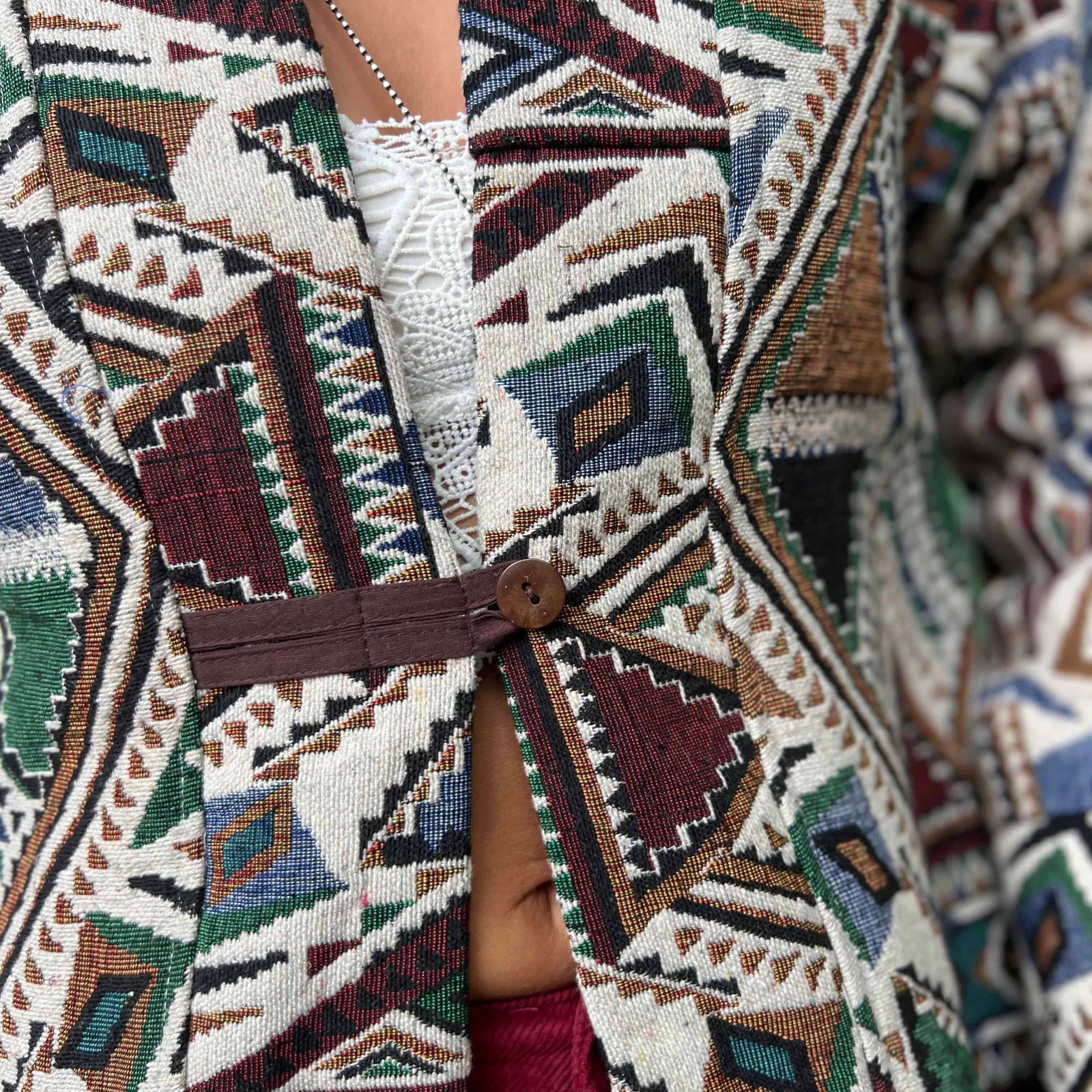 Handmade hippie boho trench coat modeled outdoors in nature