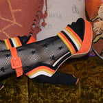 Halloween candy corn heels with orange, yellow, and black suede stripes.