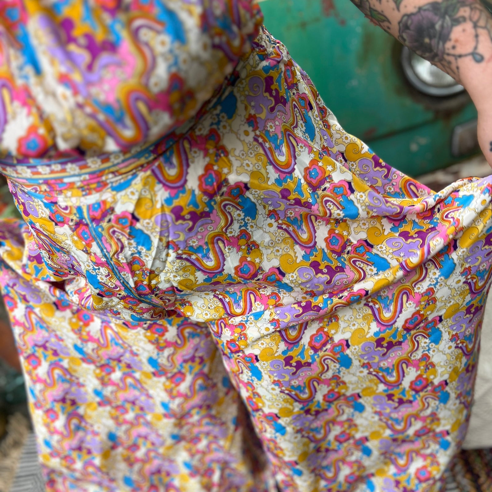 Criss-cross silk jumpsuit in rainbow tie dye print